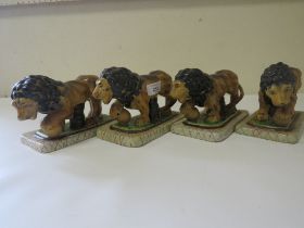 FOUR REPRODUCTION STAFFORDSHIRE STYLE LIONS FIGURES
