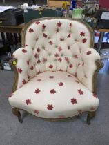 A FRENCH STYLE UPHOLSTERED ARMCHAIR