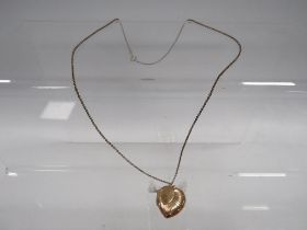 AN LOCKET ON CHAIN MARKED 9CT GOLD BACK AND FRONT