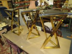 A SET OF THREE MODERN 'EICHHOLTZ' MARBLE TOPPED TRIANGULAR STANDS