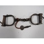 A PAIR OF VICTORIAN HAND CUFFS