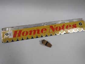 AN ADVERTISING HOME NOTES LETTER BOX STYLE COVER TOGETHER WITH AN ACME THUNDERER WHISTLE