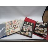 A STAMP COLLECTION IN TWO FOLDERS INCLUDING LOOSE STAMPS