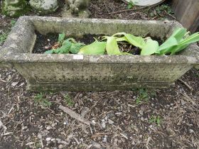 A HEAVY CONCRETE GARDEN PLANTER