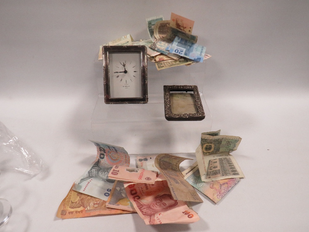 A SMALL HALLMARKED SILVER PHOTO FRAME TOGETHER WITH WHITE METAL FRAMED DESK CLOCK AND A COLLECTION