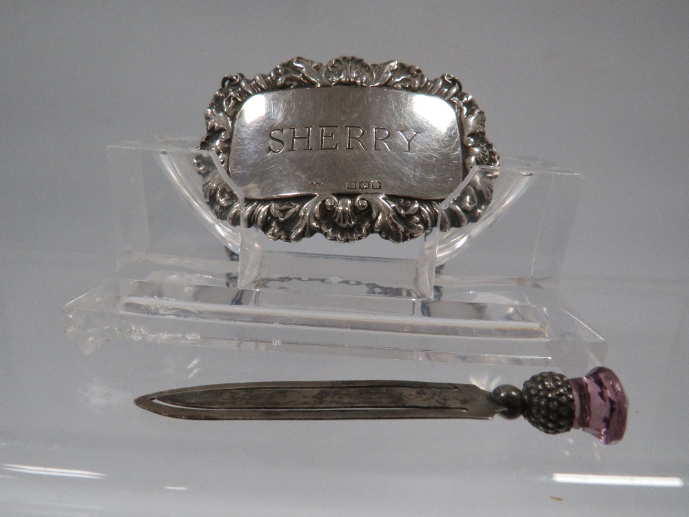 A HALLMARKED SILVER PAGE MARKER AND SILVER WINE LABEL