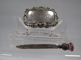 A HALLMARKED SILVER PAGE MARKER AND SILVER WINE LABEL