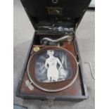 A VINTAGE WIND UP HMV GRAMOPHONE (UNCHECKED) TOGETHER WITH A ALBUM OF 78'S RECORDS