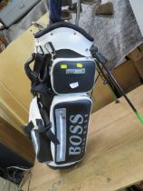 A HUGO BOSS GOLF BAG AND GOLF CLUBS TO INCLUDE PING AND CALLAWAY