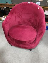 A MODERN UPHOLSTERED PURPLE CHAIR