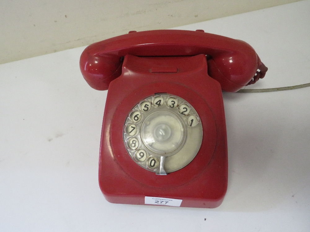 A VINTAGE RED TELEPHONE WITH MODERN CABLE A/F