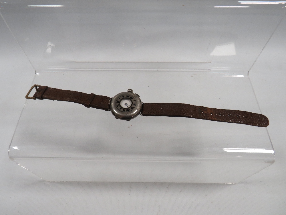 AN ANTIQUE TRENCH WRISTWATCH WITH SILVER HUNTING STYLE CASE