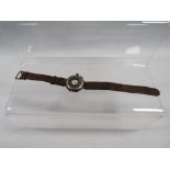 AN ANTIQUE TRENCH WRISTWATCH WITH SILVER HUNTING STYLE CASE
