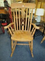 A HEAVY PINE KITCHEN ROCKING CHAIR