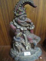 AN ANTIQUE CAST IRON DOOR STOP IN THE FORM OF MR PUNCH