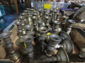 A TRAY OF ASSORTED GUILT METAL CANDLESTICKS