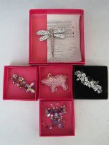 THREE BUTLER AND WILSON BUTTERFLY THEMED BROOCHES, largest W 7 cm, together with a dragonfly