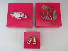 A BUTLER AND WILSON DIAMANTE HAND BROOCH, L 9 cm, together with a large red rose brooch H 9.5 cm and