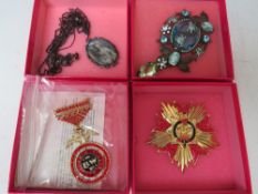 TWO BUTLER AND WILSON MILITARY THEMED BROOCHES, the medal style brooch L 9 cm, together with a large