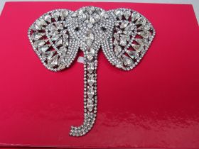 A LARGE BUTLER AND WILSON CLEAR DIAMANTE ELEPHANT BROOCH, with articulated trunk, W 11.5 cm