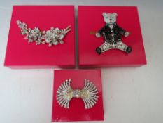 A LARGE BUTLER AND WILSON TEDDY BEAR BROOCH, H 12 cm, together with a floral spray brooch - H 12 cm,