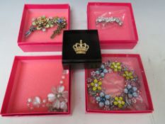 A LARGE BUTLER AND WILSON FLORAL THEMED CIRCULAR BROOCH, W 11 cm, together with a articulated floral