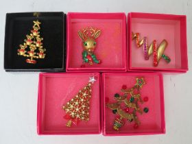 A SELECTION OF FOUR BUTLER AND WILSON CHRISTMAS TREE BROOCHES, together with a Butler and Wilson