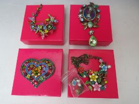 FOUR BUTLER AND WILSON COSTUME BROOCHES, comprising a multi-coloured heart brooch - W 8.2 cm, a frog