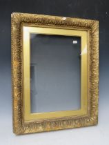 A 19TH CENTURY GOLD FRAME, with gold slip and outer leaf design, glazed, with some restoration,