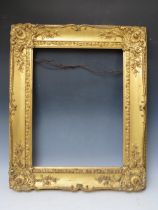 A 19TH CENTURY DECORATIVE GOLD SWEPT FRAME, frame W 10 cm, rebate 53 x 45 cm