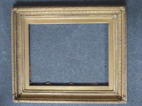 A 19TH CENTURY DECORATIVE GOLD FRAME, with gold slip, frame W 9 cm, slip rebate 60 x 47 cm, frame