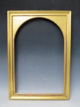 A 19TH CENTURY GOLD FRAME, with arched gold slip, frame W 3 cm, slip rebate 54 x 35 cm, frame rebate