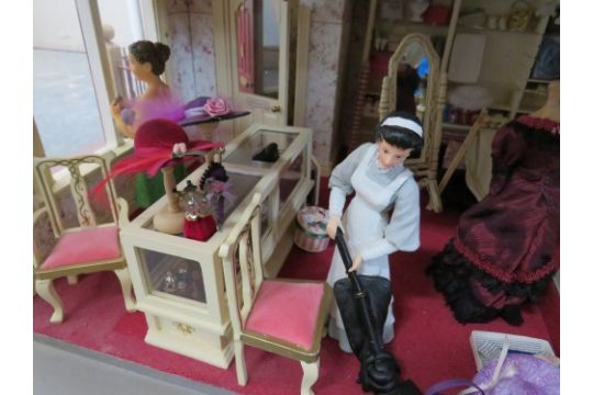 AN EXCELLENT QUALITY ROTATING BASE DOLLS HOUSE, complete with fixed furniture, has shop frontage, - Image 20 of 25