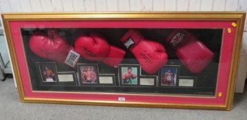 FOUR FRAMED AMERICAN HEAVYWEIGHT WORLD CHAMPION SIGNED BOXING GLOVES, to include Joe Frazier, George