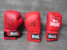 THREE SIGNED BOXING GLOVES, to include Richie Woodhall, Nigel Benn and Roberto Duran