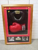 A FRAMED MUHAMMAD ALI BOXING GLOVE AND HEADGUARD, both items signed
