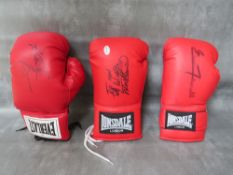 THREE SIGNED BOXING GLOVES, to include Frank Bruno, Riddick Bowe and Ernie Terrell