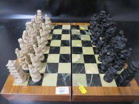 A ORIENTAL STYLE CHESS SET TOGETHER WITH A FOLDING BOARD BOX A/F