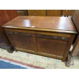 AN OAK PANELLED COFFER