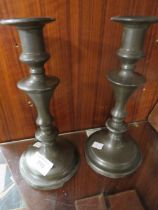 A PAIR OF ANTIQUE PEWTER CANDLESTICKS