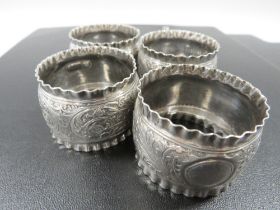 FOUR HALLMARKED SILVER NAPKIN RINGS