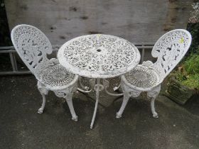 A CAST ALUMINIUM GARDEN PATIO SET WITH TWO CHAIRS AND A PARASOL BASE