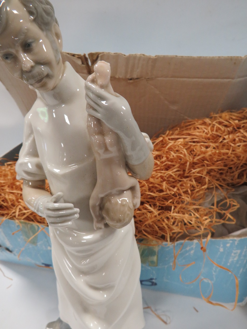 A LLADRO FIGURE OF A DOCTOR HOLDING A NEW BORN BABY TOGETHER WITH A LLADRO FIGURE OF A NURSE IN - Image 2 of 6