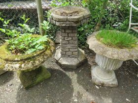 TWO CONCRETE PLATERS AND A BIRD BATH