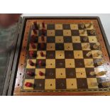 A VINTAGE TRAVELLING CHESS SET MARKED JAQUES LONDON