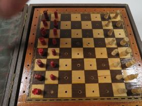 A VINTAGE TRAVELLING CHESS SET MARKED JAQUES LONDON