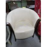 AN UPHOLSTERED TUB CHAIR