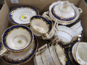 A TRAY OF BLUE AND GILT TEA WARE