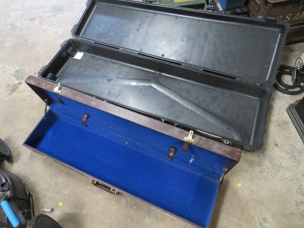 TWO GUN CASES COMPRISING ONE HARD PLASTIC AND ONE WOOD & VINYL