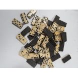 A BOX OF WOOD AND BONE DOMINOES